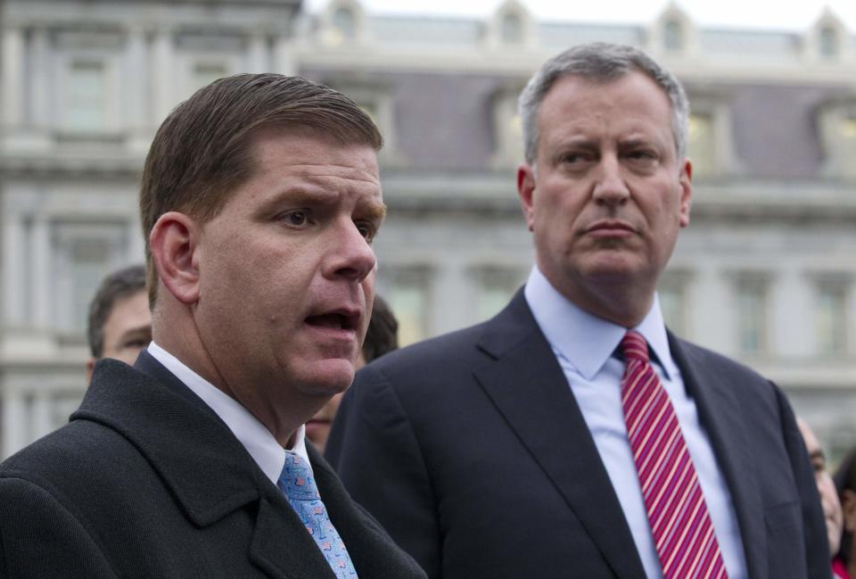 New York Mayor-elect Bill de Blasio and Boston Mayor-elect Martin Walsh (L) speak to the press outside the West Wing of the White House in Washington, December 13, 2013, following their meeting with U.S. President Barack Obama and other newly-elected mayors about job creation. REUTERS/Jason Reed (UNITED STATES - Tags: POLITICS)