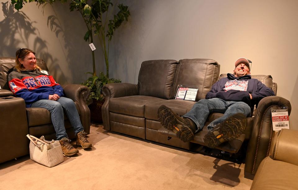 Mike and Nina Mcginnis of Marlborough shop for a sofa Saturday at Rotmans during the longtime Southbridge Street furniture store's going-out-of-business liquidation sale in Worcester.