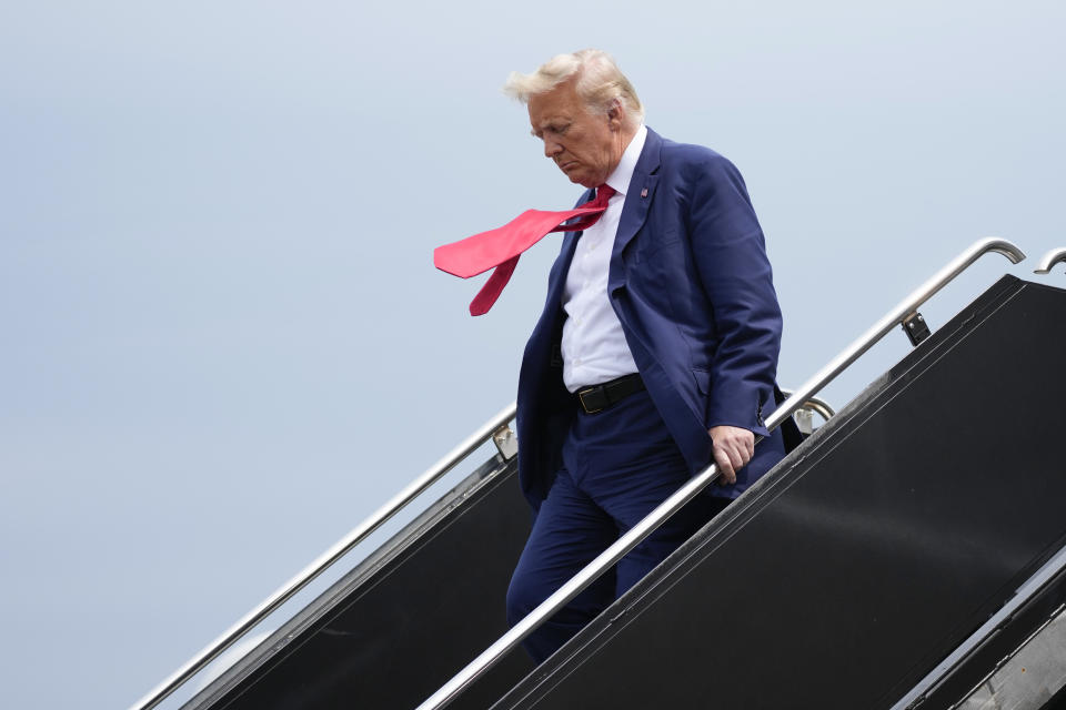 Trump arrives at Reagan National Airport in Arlington, Va., as he heads to Washington to face federal conspiracy charges over his efforts to subvert the 2020 election. 