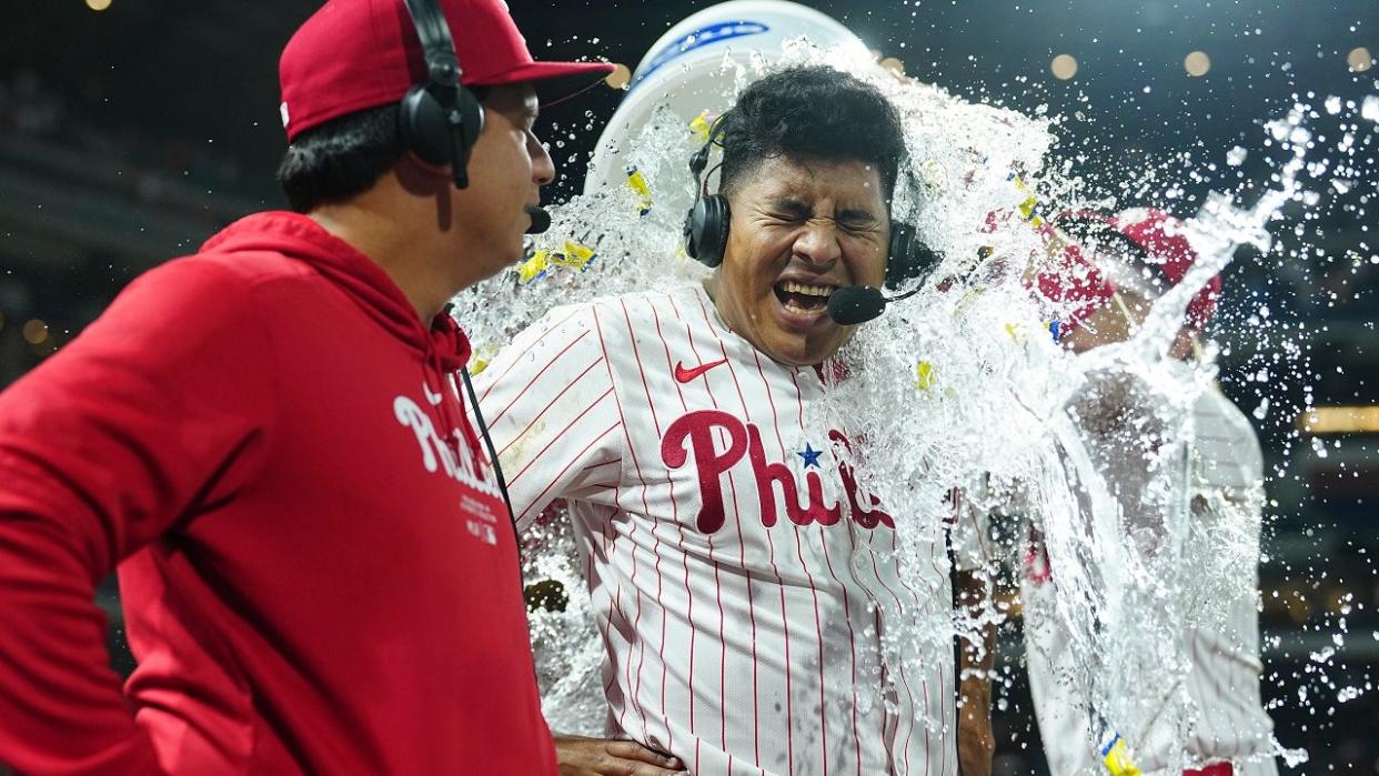 <div>PHILADELPHIA, PENNSYLVANIA - APRIL 16: Ranger Suarez #55 and translator Diego DAniello of the Philadelphia Phillies have water and gum poured on them by Bryson Stott #5 after the game against the Colorado Rockies at Citizens Bank Park on April 16, 2024 in Philadelphia, Pennsylvania. The Phillies defeated the Rockies 5-0. (Photo by Mitchell Leff/Getty Images)</div>
