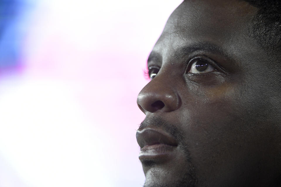 FILE - In this Aug. 31, 2017, file photo, Washington Redskins radio analyst and former running back Clinton Portis watches from the sideline during the second half of an NFL preseason football game against the Tampa Bay Buccaneers in Tampa, Fla. Former NFL players Clinton Portis, Tamarick Vanover and Robert McCune pleaded guilty for their roles in a nationwide healthcare fraud scheme, the U.S. Department of Justice announced Tuesday, Sept. 7, 2021.. (AP Photo/Phelan M. Ebenhack, File)