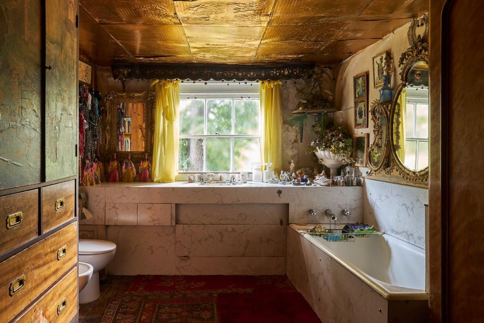 One bathroom features a gold ceiling (Kinleigh Folkard & Hayward)