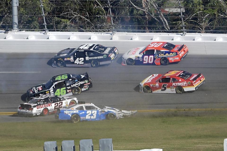 Brad Keselowski (22), Spencer Gallagher (23) and Anthony Kumpen (46) are involved in a multi-car accident in Turn 3 as Tyler Reddick (42), Mario Gosselin (90) and Michael Annett (5) drive past during a NASCAR Xfinity series auto race at Daytona International Speedway, Saturday, Feb. 25, 2017, in Daytona Beach, Fla. (AP Photo/Phelan M. Ebenhack)