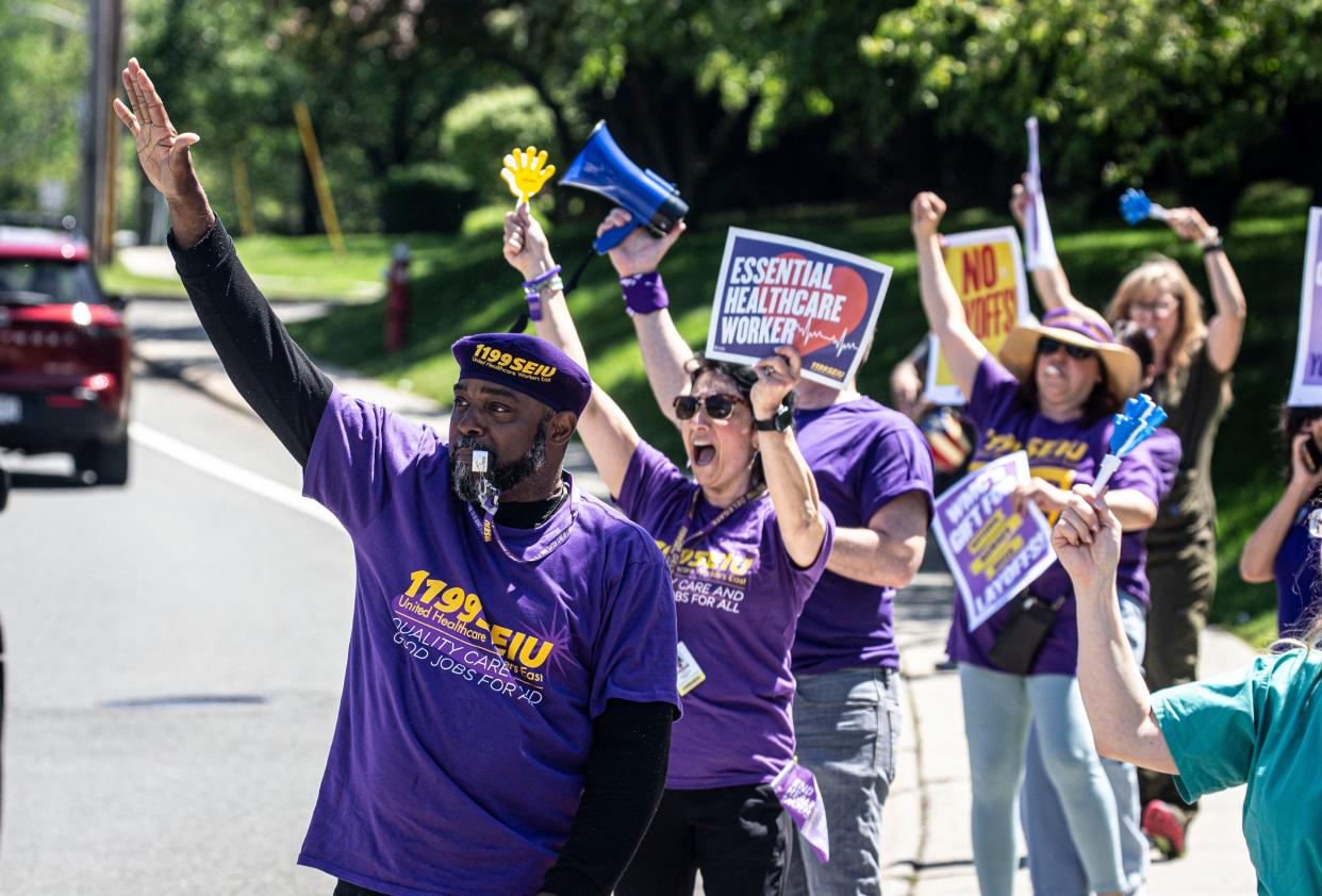 Health care workers at Good Samaritan Hospital in Suffern stand on route 59 outside the hospital May 7, 2024 as they protest layoffs that Bon Secours Charity Health System, which includes Good Samaritan, were hit with recently. About 50 workers at various Bon Secours hospitals in the Hudson Valley were laid off.