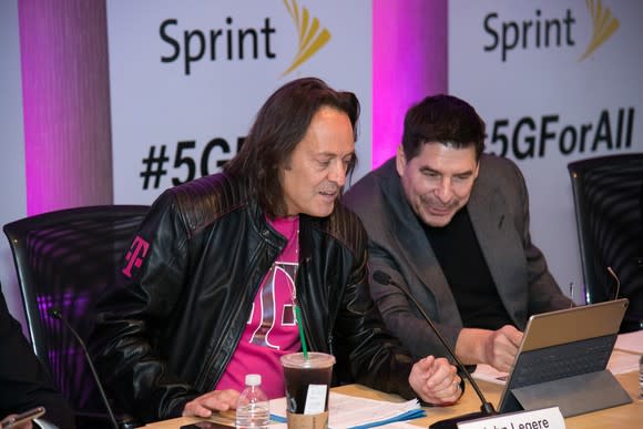 T-Mobile CEO John Legere and Sprint Executive Chairman Marcelo Claure are on stage together