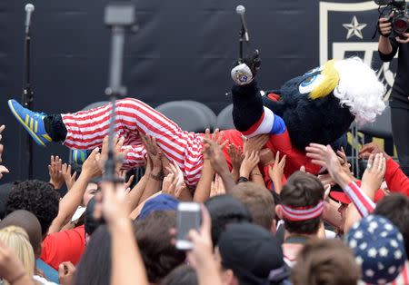 Jul 7, 2015; Los Angeles, CA, USA; Los Angeles Galaxy mascot Cosmo wears a United States jersey at 2015 Womens World Cup champions celebration at Microsoft Square at L.A. Live. Mandatory Credit: Kirby Lee-USA TODAY Sports