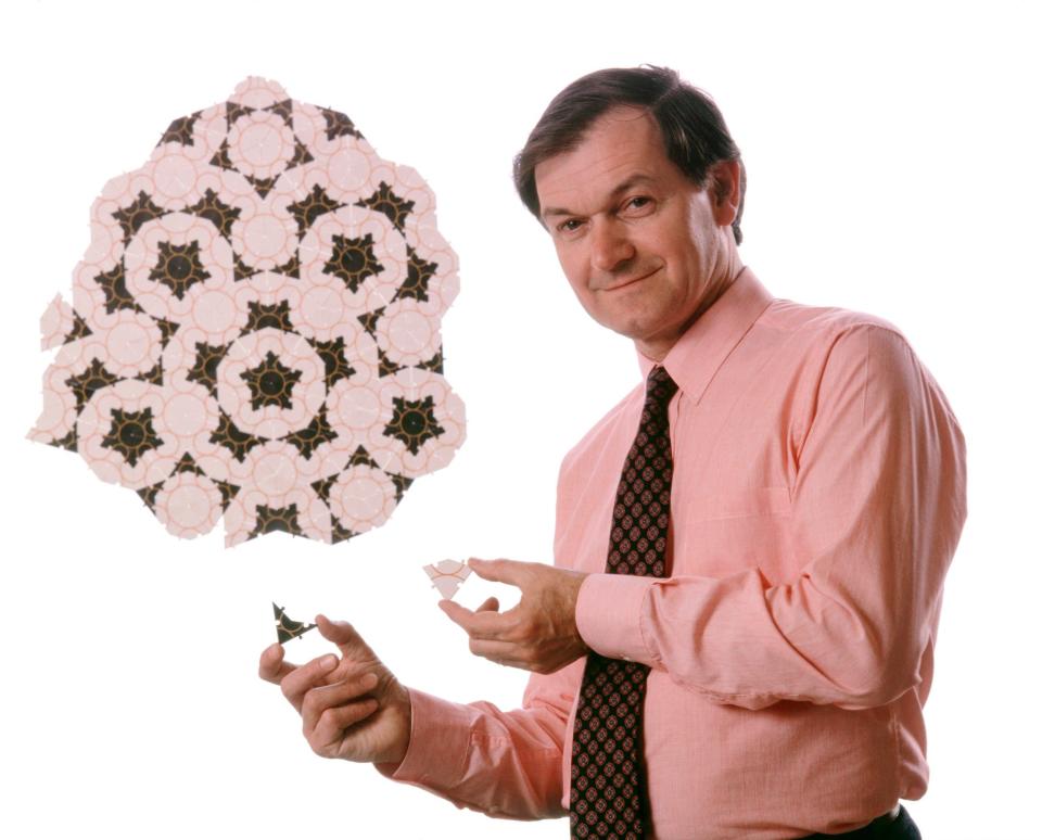 Roger Penrose (born 1931), British mathematician, with the Penrose tiling system named after him. Penrose, renowned for his work in mathematical physics, studied this tiling system in the 1970s. Using only two tiles of a particular shape, complex, non-repeating patterns can be generated. Penrose has also worked on black holes, cosmology, quantum mechanics and human consciousness. His awards include the Eddington Medal, the Royal Medal, the Wolf Prize, and the Albert Einstein Medal. Penrose was knighted in 1994. Photographed in 1989 - CORBIN O'GRADY/SCIENCE PHOTO LIBRARY