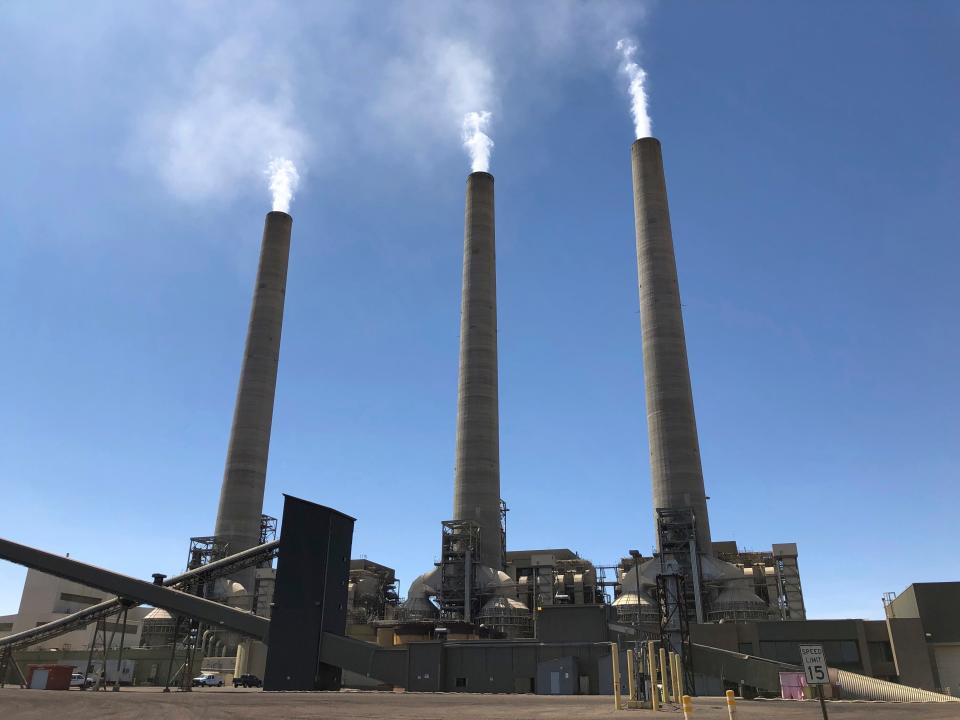 This Aug. 20, 2019, photo shows a trio of concrete stacks at the Navajo Generating Station near Page.