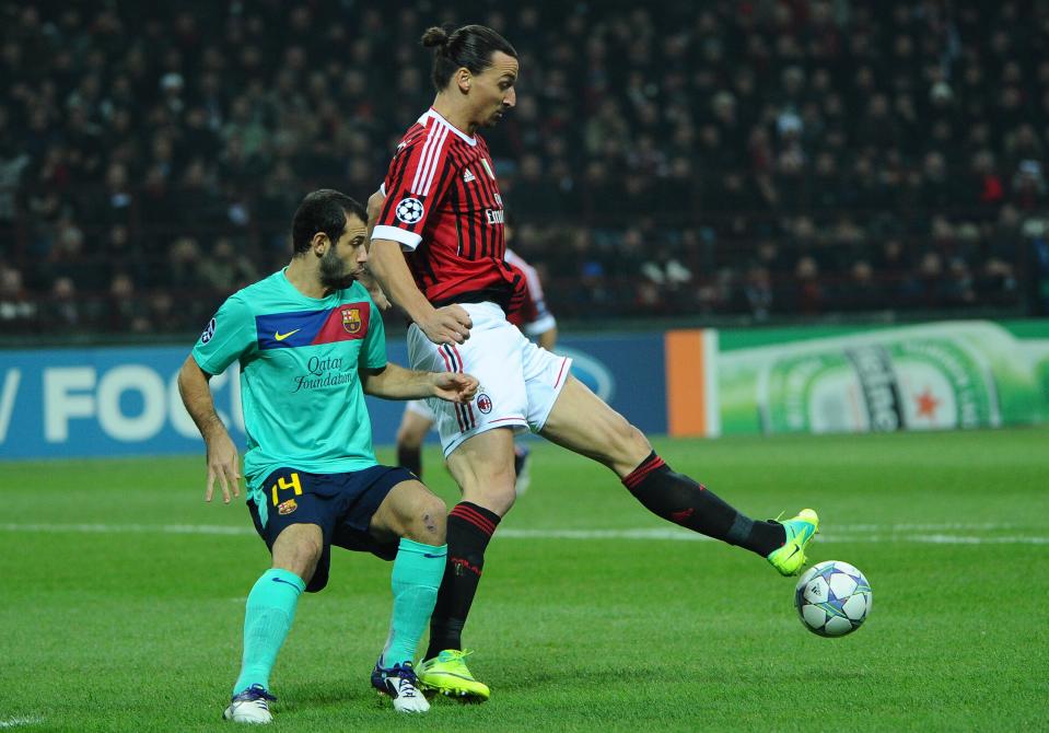 AC Milan's Swedish forward Zlatan Ibrahimovic (R) fights for the ball with FC Barcelona's Argentinian midfielder Javier Mascherano during the Champions League group H football match AC Milan vs FC Barcelona on November 23, 2011 at San Siro stadium in Milan. AFP PHOTO / OLIVIER MORIN (Photo credit should read OLIVIER MORIN/AFP/Getty Images)