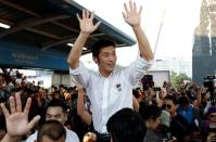 Juangroongruangkit of Thailand's progressive Future Forward Party reacts with his supporters at a sudden unauthorised rally in Bangkok