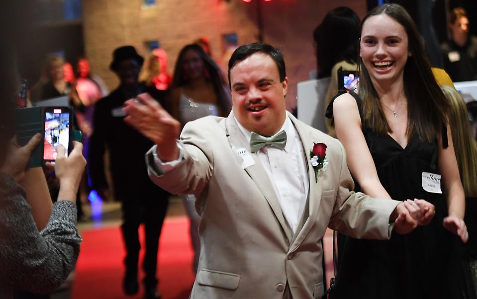 First Baptist Spartanburg joined with the Tim Tebow Foundation to host its annual 'Night to Shine Prom' event for adults with special needs. The event was held at the 'Hangar' in downtown Spartanburg on Feb. 9, 2024. Here, the guests and their escorts 'buddies' walk the Red Carpet.