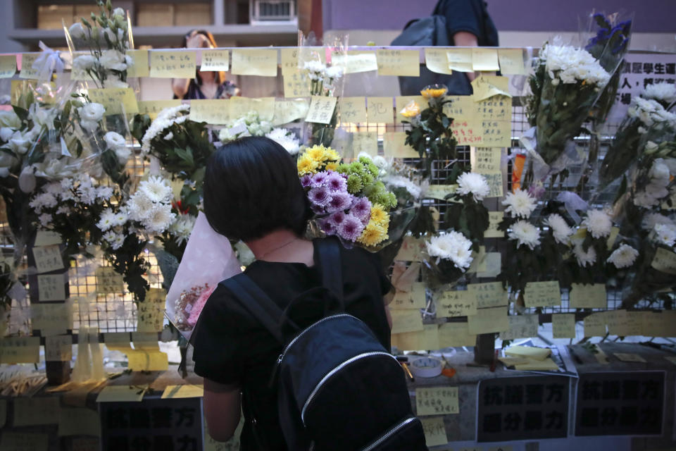 People pay their respects for protesters who were injured on Aug 31 outside Prince Edward station, in Hong Kong, Wednesday, Sept. 4, 2019. Hong Kong Chief Executive Carrie Lam has announced the government will formally withdraw an extradition bill that has sparked months of demonstrations in the city, bowing to one of the protesters' demands. The bill would have allowed Hong Kong residents to be sent to mainland China for trials. It sparked massive protests that have become increasingly violent and caused the airport to shut down earlier this month. (AP Photo/Jae C. Hong)