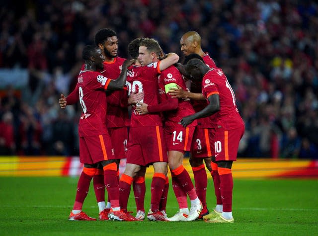 Liverpool players celebrate Jordan Henderson's winner