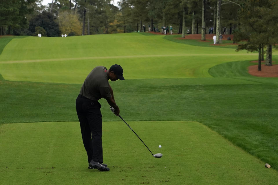 Tiger Woods tees off on the 17th hole during the first round of the Masters golf tournament Thursday, Nov. 12, 2020, in Augusta, Ga. (AP Photo/Charlie Riedel)
