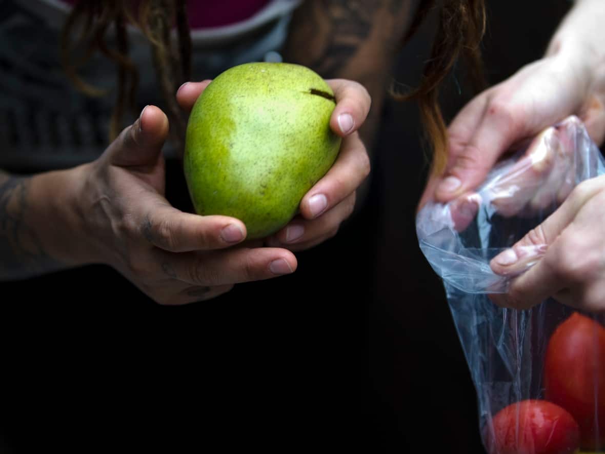 Fruit and vegetables are the food items most often trashed while still edible. Food waste is an ongoing problem in countries like Canada as it contributes to greenhouse gas emissions and costs Canadians around $1,300 on average per household per year. (Ben Nelms/Reuters - image credit)