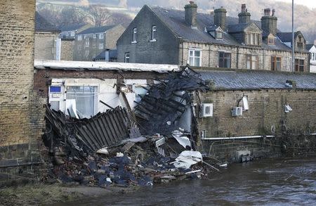 A building that collapsed during flooding is seen in the town of Mytholmroyd, northern England, December 27, 2015. REUTERS/Andrew Yates