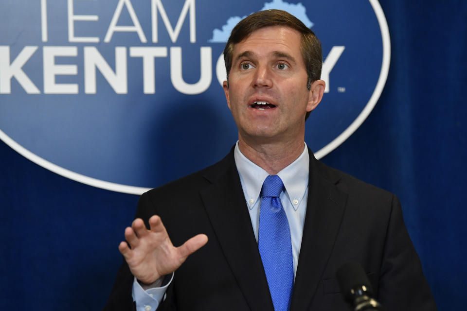 Kentucky Gov. Andy Beshear speaks to reporters following the signing of bills related to the American Rescue Plan Act at the Kentucky State Capitol in Frankfort, Ky., Wednesday, April 7, 2021. (AP Photo/Timothy D. Easley)