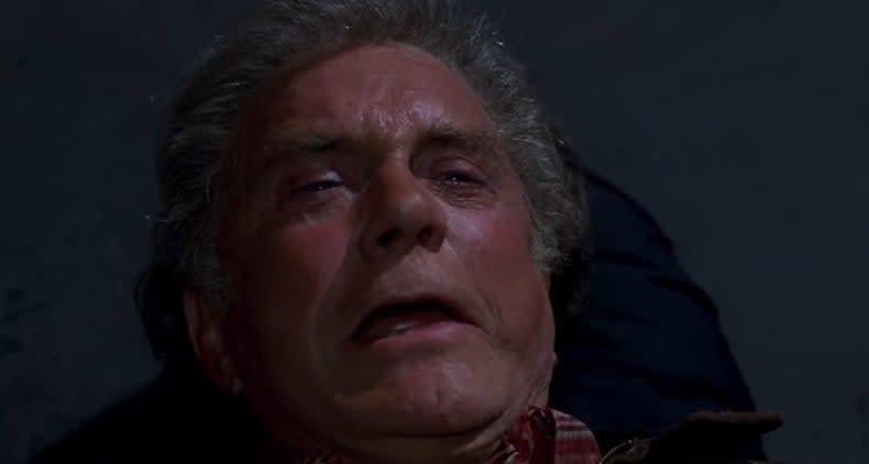 Uncle Ben lying on the ground, crying, after being shot in "Spider-Man"