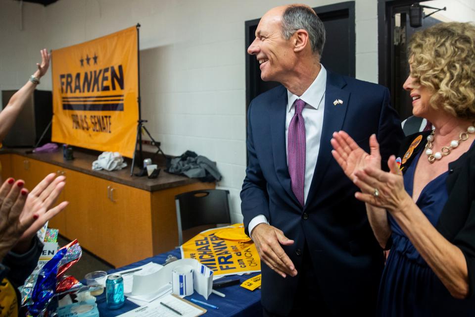 Winner of the Democratic primary for U.S. Senate Mike Franken, retired Navy admiral from Sioux City, enters his election night gathering accompanied by his wife, Jordan Franken, on Tuesday, June 7, 2022, at Franklin Junior High, in Des Moines.