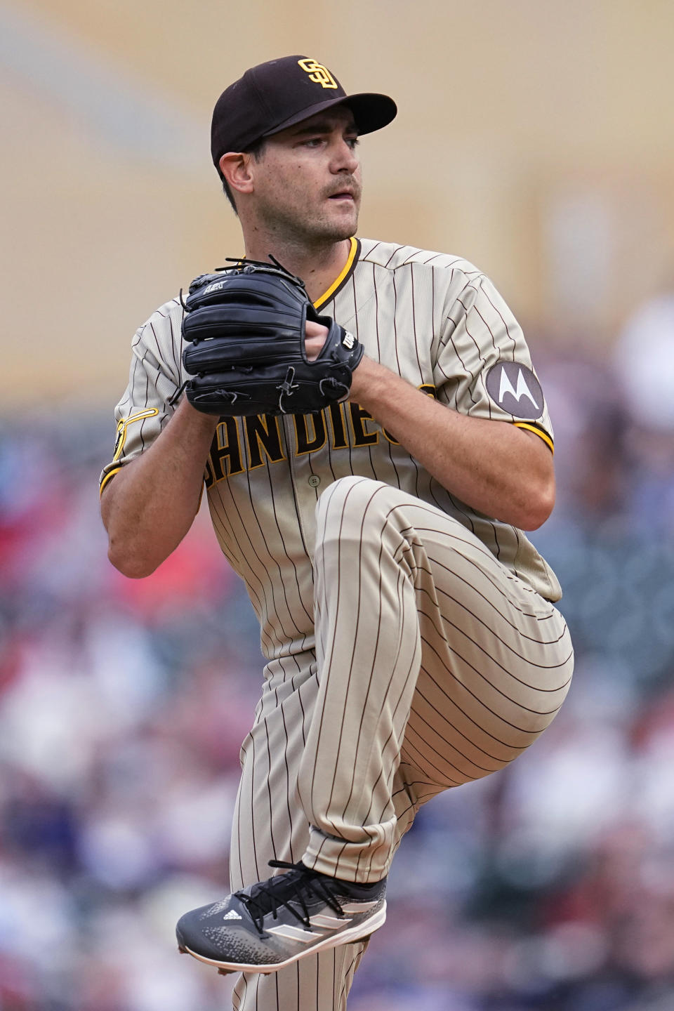 San Diego Padres starting pitcher Seth Lugo winds up during the first inning of the team's baseball game against the Minnesota Twins, Wednesday, May 10, 2023, in Minneapolis. (AP Photo/Abbie Parr)