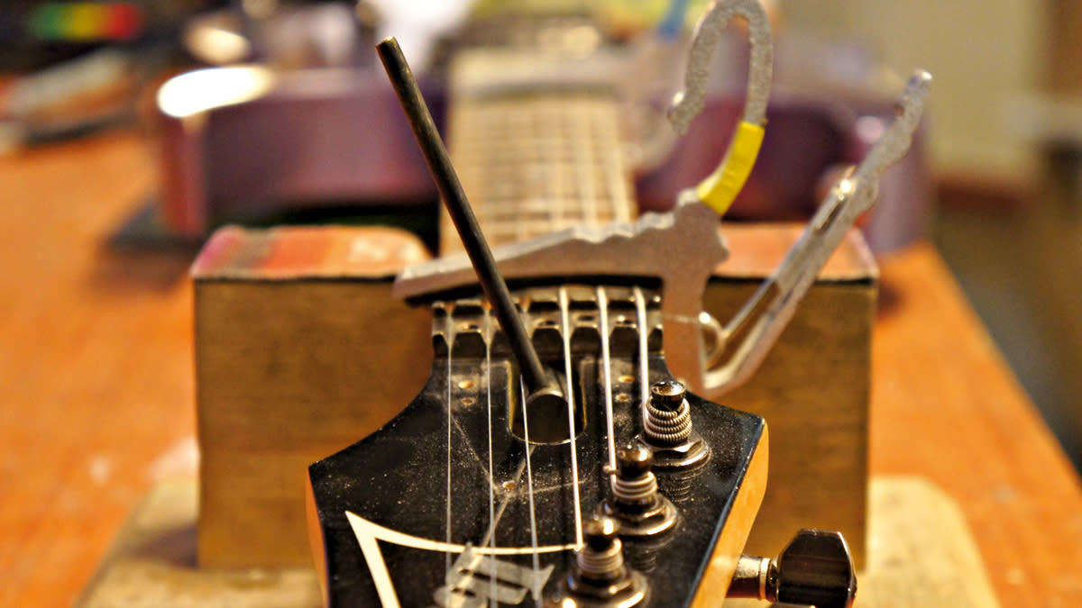  Guitar truss rod being adjusted. 