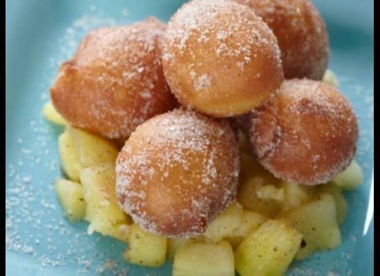 Doughnuts or sufganiyot (filled with jelly) are a traditional sweet treat for Hanukkah. This recipe uses a pate a choux base (made without leavening) to create little doughnut holes. Fry in a copious amount of peanut oil in a Dutch oven or a deep fryer for best results. Roll the fried doughnuts in cinnamon and sugar and serve with apple compote (also a nice topping for latkes).    <strong>Get the <a href="http://www.huffingtonpost.com/2011/10/27/cinnamon-sugared-doughnut_n_1057279.html" target="_hplink">Cinnamon-Sugared Doughnut Holes with Green Apple Compote</a> recipe</strong>