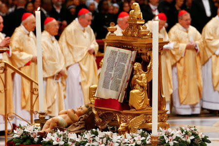 The statuette of baby Jesus is seen during the traditional midnight Mass led by Pope Francis in St. Peter's Basilica on Christmas Eve at the Vatican December 24, 2017. REUTERS/Tony Gentile