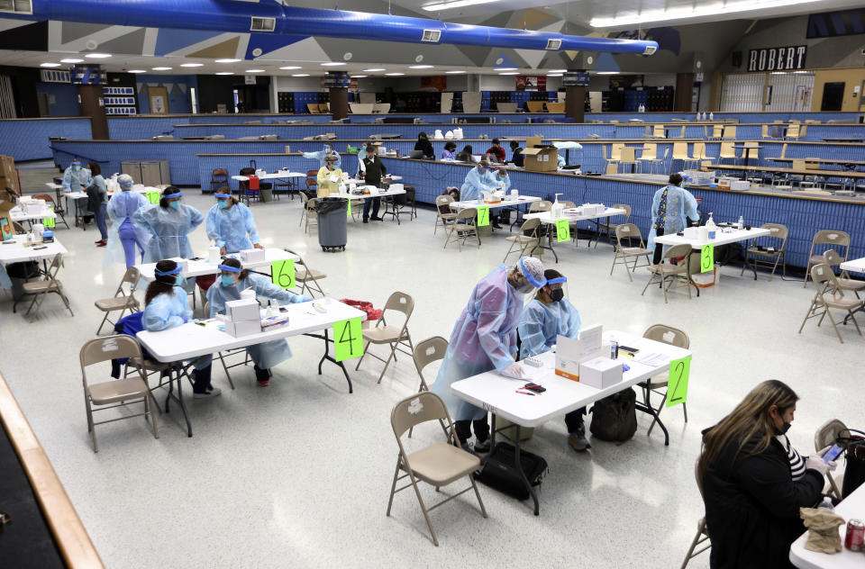 The cafeteria at Robert Vela High School was the site for COVID-19 testing for staff and students Monday, Jan. 3, 2022, in Edinburg, Texas. Edinburg CISD staff are scheduled to return to campuses on Wednesday, Jan. 5. (Delcia Lopez/The Monitor via AP)