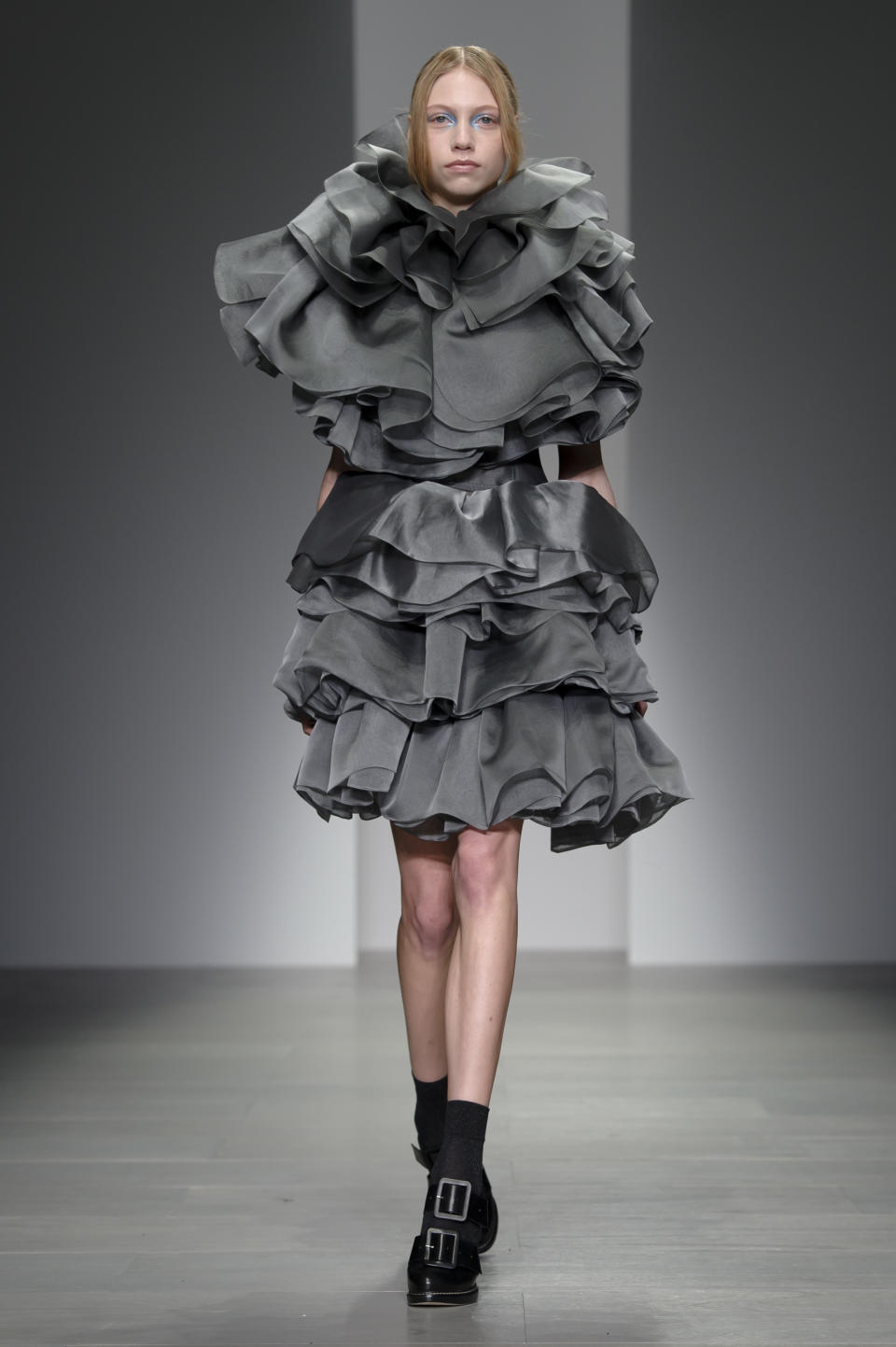 A model wears a design created by John Rocha during London Fashion Week Autumn/Winter 2014, at Somerset House in central London, Saturday, Feb. 15, 2014. (Photo by Jonathan Short/Invision/AP)