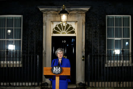 Britain's Prime Minister Theresa May makes a statement following winning a confidence vote, after Parliament rejected her Brexit deal, outside 10 Downing Street in London, Britain, January 16, 2019. REUTERS/Henry Nicholls