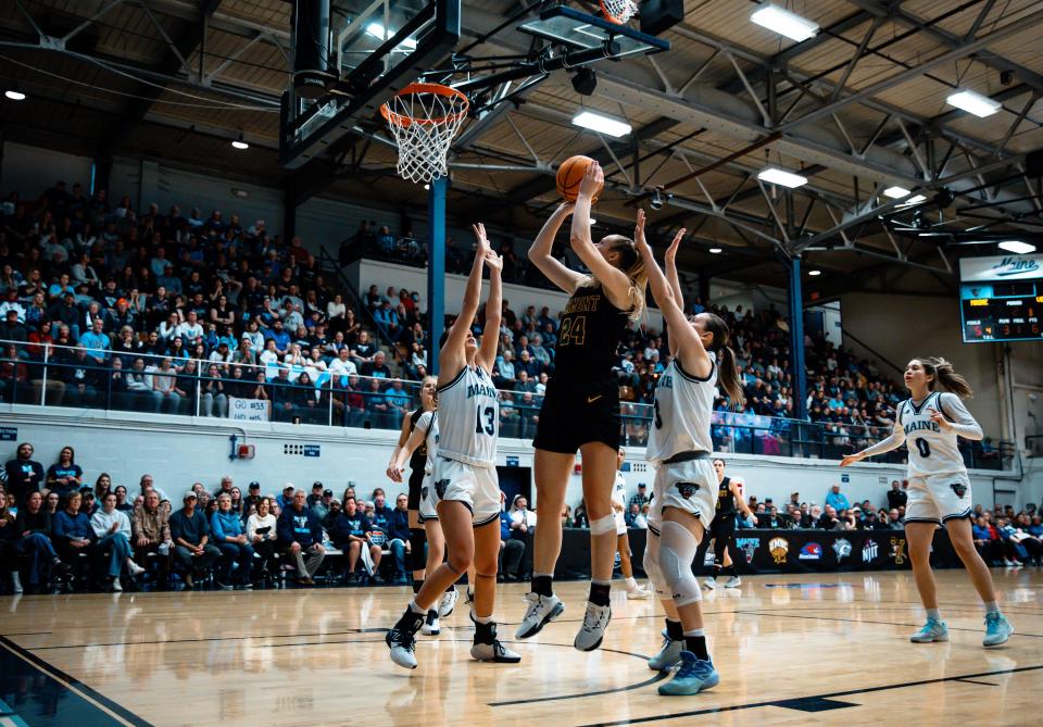 Vermont's Anna Olson goes up for two during Vermont's 66-48 loss to Maine in the 2024 America East women's basketball title game on Friday, March 15.