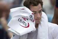 Andy Murray of Britain wipes down before his second round match against Adrian Mannarino of France at the U.S. Open Championships tennis tournament in New York, September 3, 2015. REUTERS/Carlo Allegri