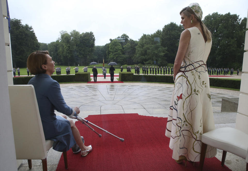 Queen Maxima of the Netherlands, right, and Elke Buedenbender, wife of German President Frank-Walter Steinmeier, wait for the military welcome ceremonial at the Bellevue palace in Berlin, Germany, Monday, July 5, 2021. The Dutch Royals arrived in Germany for a three-day visit that was delayed from last year because of the coronavirus pandemic. (Wolfgang Kumm/dpa via AP)