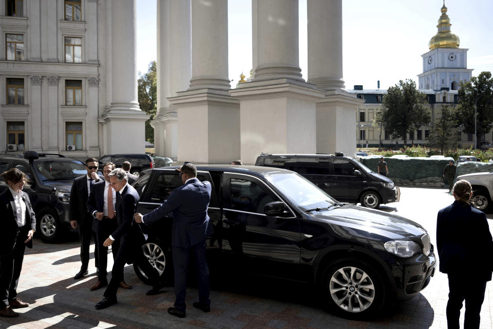 US Secretary of State Antony Blinken, center, gets out of a car as he arrives at the Ministry of Foreign Affairs for a meeting with Ukraine's Foreign Minister Dmytro Kuleba, in Kyiv, Ukraine, Wednesday, Sept. 6, 2023. Blinken arrived in Kyiv on an unannounced visit Wednesday, hours after Russia launched its first missile attack in a week against the Ukrainian capital. (Brendan Smialowski/Pool Photo via AP)