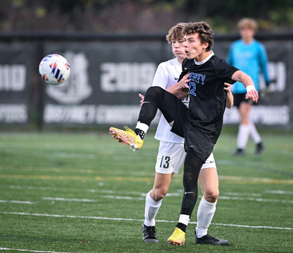 Liberty’s Aidan Gordon, forefront, has been voted one of the top boys soccer players in Ohio for 2023.