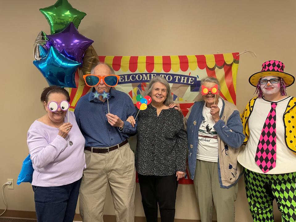 "Aging is a Circus" was the theme of the Crawford County Council on Aging's Older Americans Month celebration on May 25. Enjoying the fun, from left, are Toni Lind, John Sams, Gerry Sams, Marilyn Smith and COA employee Ashley as the clown.