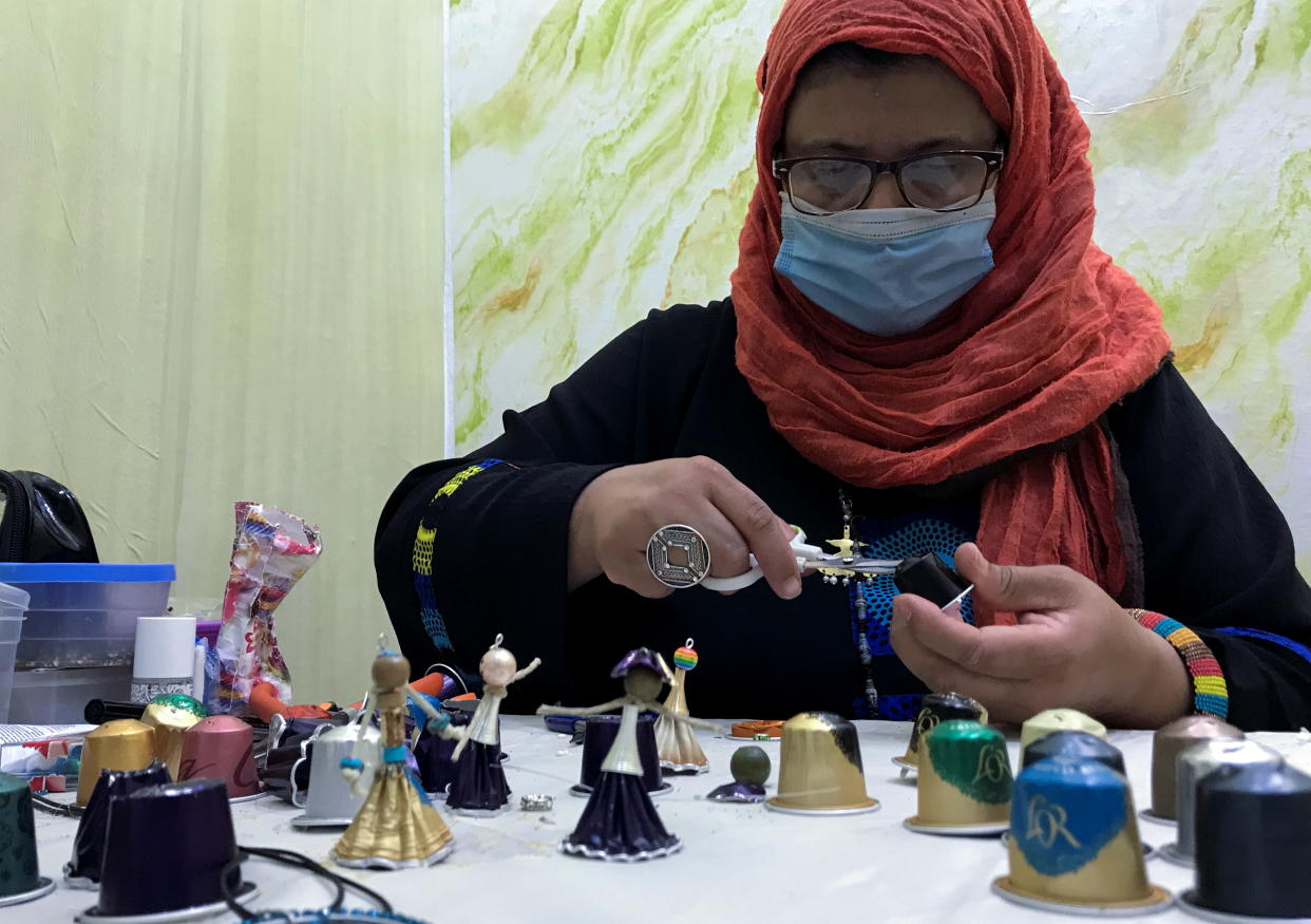 Algerian artist Djamila Bekkour uses upcycled coffee capsules to create ornamental pieces inside her workshop in Algiers, Algeria July 13, 2021. Picture taken July 13, 2021. REUTERS/Abdelaziz Boumzar