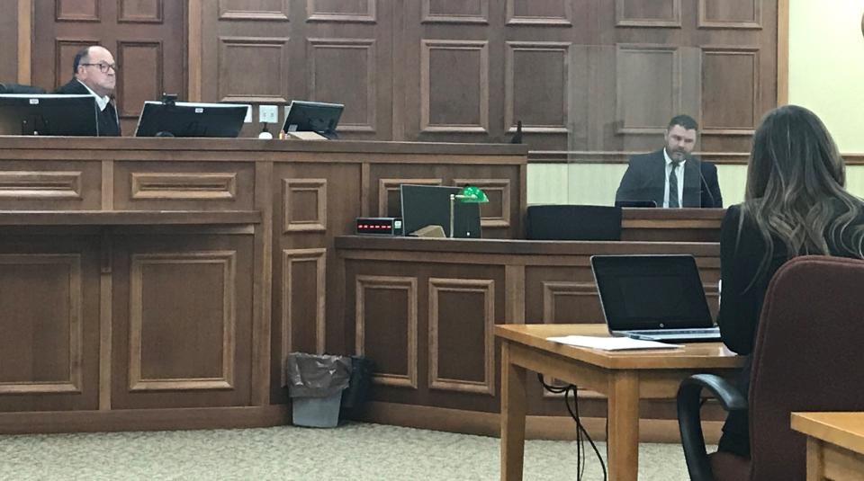 Sturgeon Bay Police Department Sgt. Investigator Luke Deibele, second from right, testifies to Door County District Attorney Colleen Nordin, right, and Judge Todd Ehlers in a preliminary hearing for Anthony Gonzalez of Sturgeon Bay, who faces two second-degree reckless homicide charges and six other charges resulting from a Feb. 22 fire at Butch's Bar.