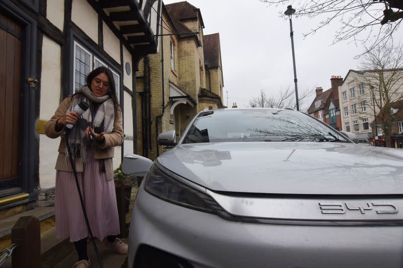 Clare Tan gets ready to charge her electric BYD Atto 3 using a home charger in Berkhamsted