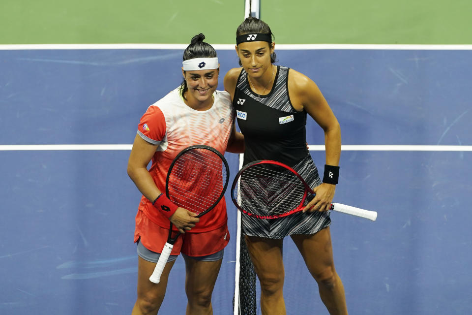 Ons Jabeur, of Tunisia, left, and Caroline Garcia, of France, pose ahead of a match during the semifinals of the U.S. Open tennis championships, Thursday, Sept. 8, 2022, in New York. (AP Photo/Julia Nikhinson)