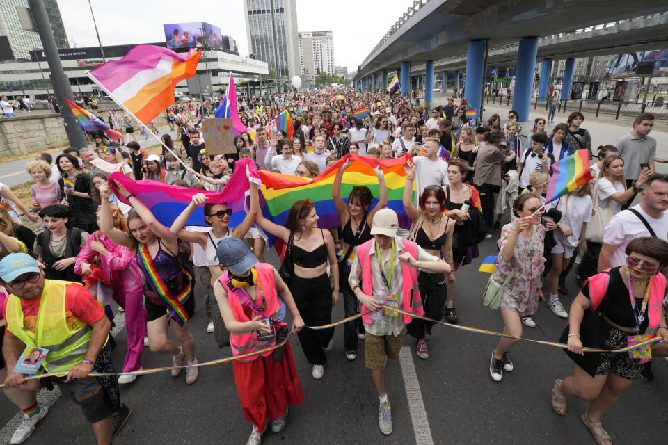 People take part in the yearly pride parade, known as the Equality Parade, in Warsaw, Poland, on Saturday, June 17, 2023. (AP Photo/Czarek Sokolowski)