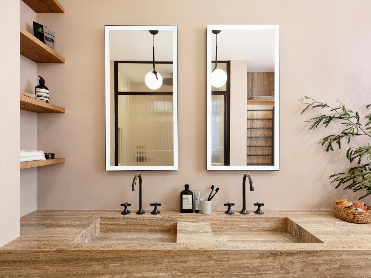  a modern bathroom with no splashback behind vanity 