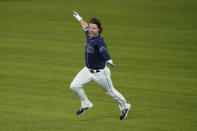 Tampa Bay Rays' Brett Phillips (14) celebrates the game winning hit against the Los Angeles Dodgers in Game 4 of the baseball World Series Saturday, Oct. 24, 2020, in Arlington, Texas. Rays defeated the Dodgers 8-7 to tie the series 2-2 games. (AP Photo/Tony Gutierrez)