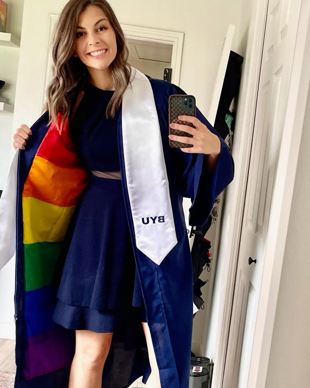 Jillian Orr shows a peek of the rainbow flag under her gown.  (Courtesy Jillian Orr)