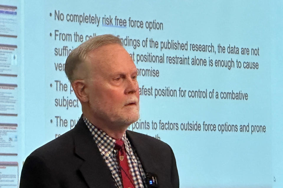 Darrell Ross, a criminal justice professor at Valdosta State University, gives a presentation on his prone restraint studies while speaking to members of law enforcement attending a conference hosted by the Institute for the Prevention of In-Custody Deaths in Las Vegas on Oct. 24, 2023. (AP Photo/Martha Bellisle)