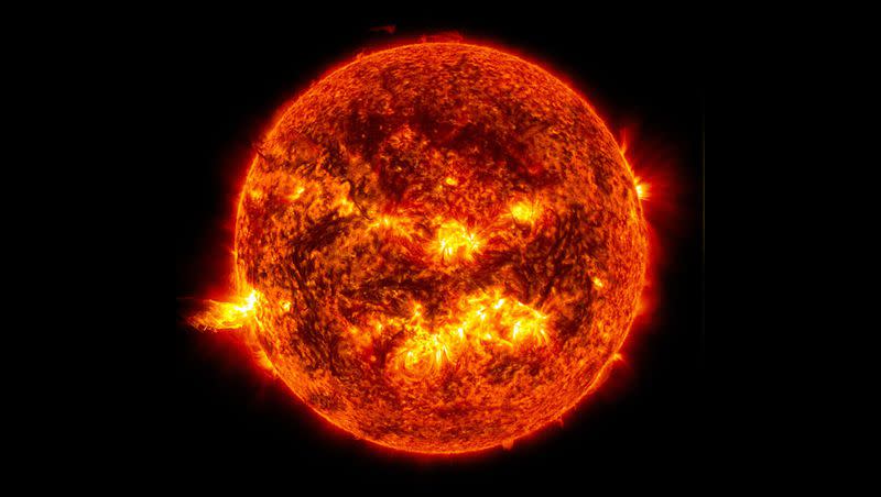 This image captured by NASA’s Solar Dynamics Observatory on June 20, 2013, shows the bright light of a solar flare on the left side of the sun.