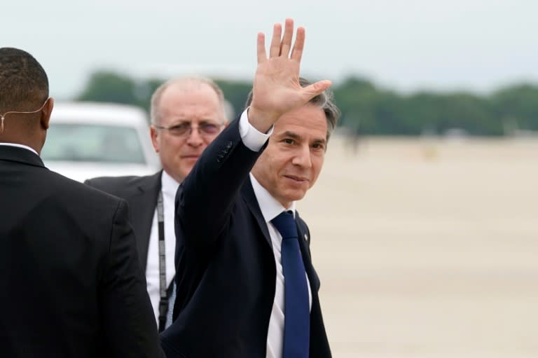 US Secretary of State Antony Blinken waves as he departs Andrews Air Force Base, Maryland