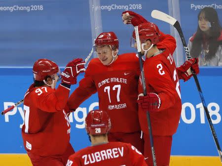 Ice Hockey – Pyeongchang 2018 Winter Olympics – Men Preliminary Round Match – Olympic Athletes from Russia v Slovenia - Gangneung Hockey Centre, Gangneung, South Korea – February 16, 2018 - Kirill Kaprizov, an Olympic Athlete from Russia, celebrates his goal with teammates. REUTERS/Grigory Dukor