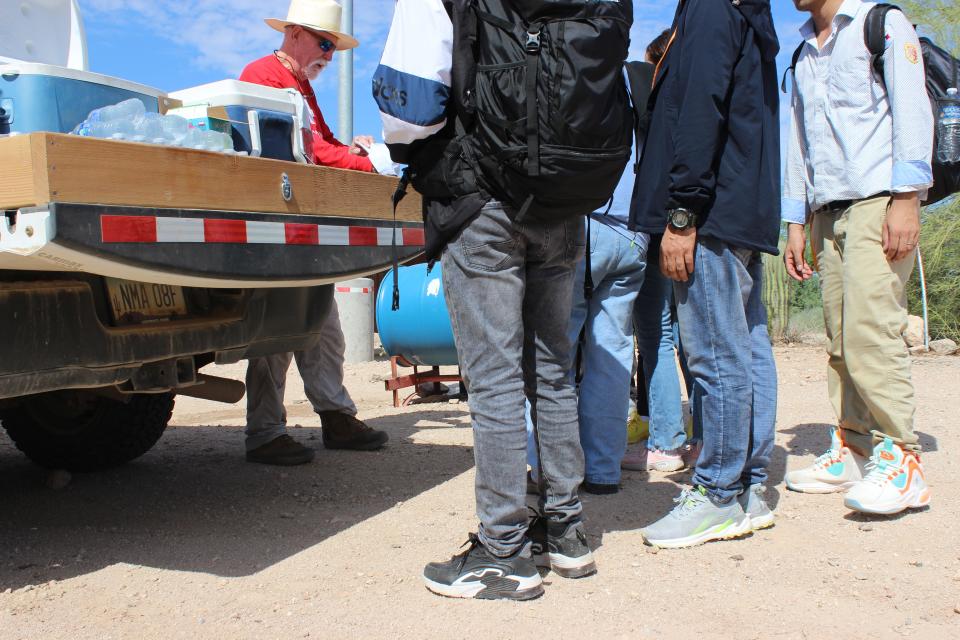 Tom Wingo, 76, refills water drums and gives water to migrants on the Organ Pipe Cactus National Monument west of Lukeville on Tuesday, August 22, 2023.