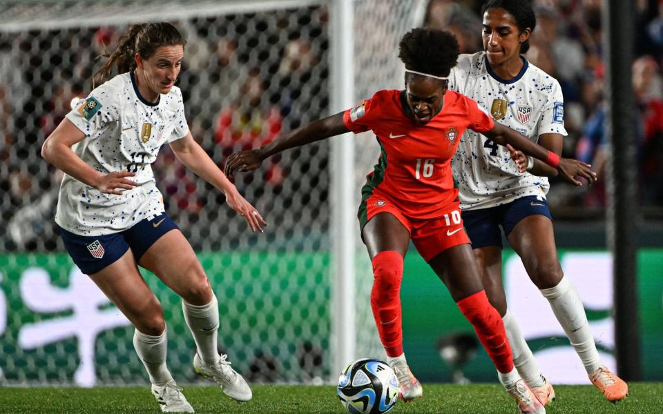 Diana Silva runs with the ball next to USA's defender #04 Naomi Girma (R) during the Australia and New Zealand 2023 Women's World Cup Group E football match between Portugal and the United States at Eden Park in Auckland on August 1, 2023